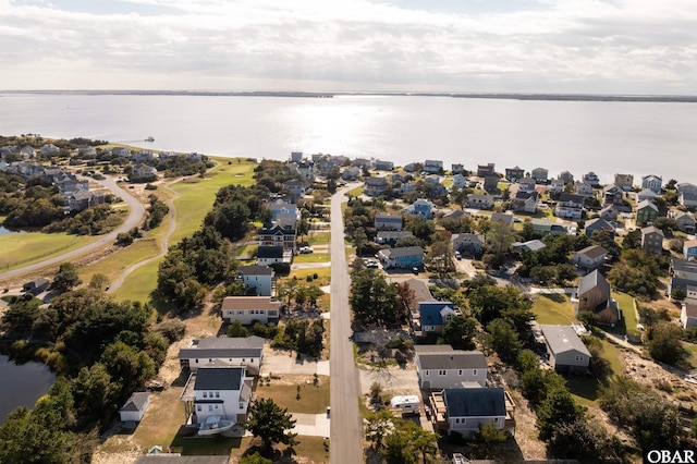 drone / aerial view with a residential view and a water view