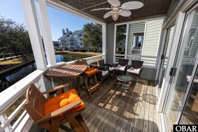 314 Pirates Way Unit 314B, Manteo, NC 27954 - sunroom / solarium with ceiling fan, a water view, and plenty of natural light