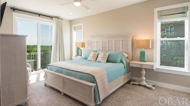 bedroom featuring light carpet, ceiling fan, and baseboards