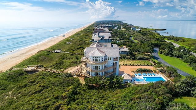 bird's eye view with a water view and a view of the beach