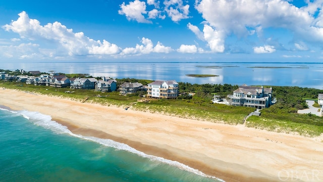 aerial view featuring a water view and a view of the beach