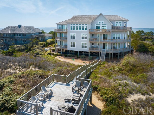 back of house with a water view