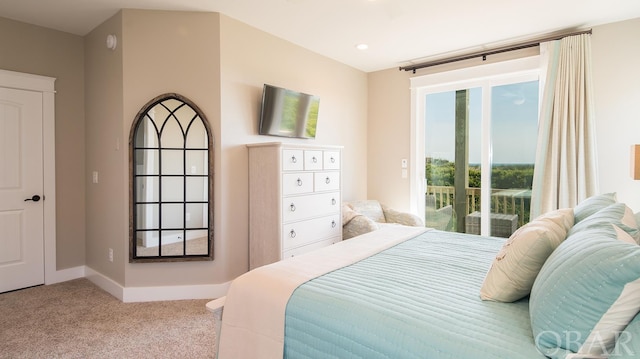 bedroom featuring light carpet, access to outside, and baseboards