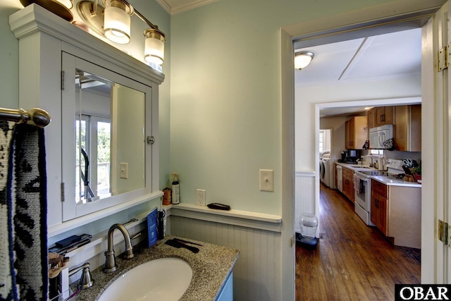 155 Loop Rd Lot 5, Ocracoke, NC 27960 - bathroom with crown molding, wood finished floors, vanity, and washing machine and clothes dryer