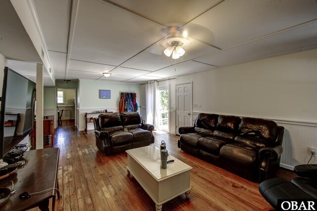 155 Loop Rd Lot 5, Ocracoke, NC 27960 - living room with dark wood finished floors, ceiling fan, and wainscoting