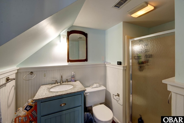 155 Loop Rd Lot 5, Ocracoke, NC 27960 - bathroom featuring a stall shower, vanity, toilet, wainscoting, and lofted ceiling