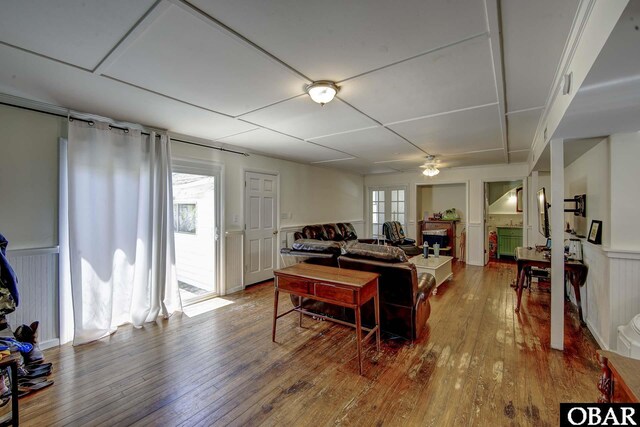 155 Loop Rd Lot 5, Ocracoke, NC 27960 - living room featuring hardwood / wood-style flooring, a wainscoted wall, ceiling fan, a fireplace, and a decorative wall