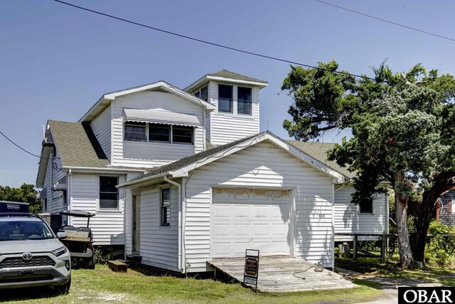 155 Loop Rd Lot 5, Ocracoke, NC 27960 - view of front of property with a garage and a shingled roof