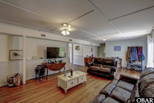 155 Loop Rd Lot 5, Ocracoke, NC 27960 - living area with wood finished floors, a ceiling fan, and wainscoting