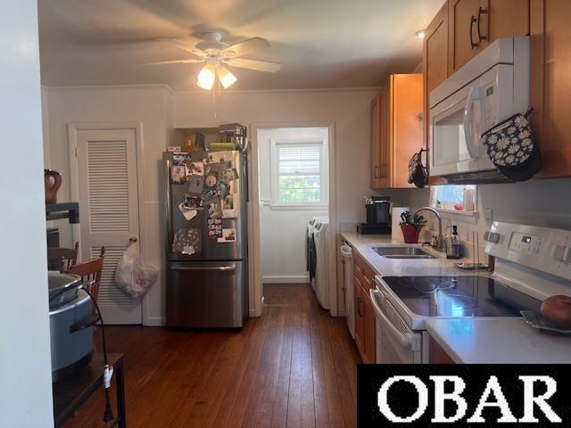 155 Loop Rd Lot 5, Ocracoke, NC 27960 - kitchen with a sink, a ceiling fan, white appliances, brown cabinetry, and dark wood-type flooring