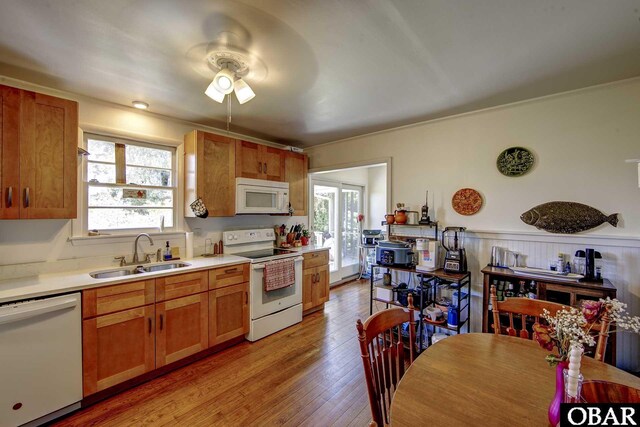 155 Loop Rd Lot 5, Ocracoke, NC 27960 - kitchen featuring white appliances, a sink, a ceiling fan, healthy amount of natural light, and wainscoting