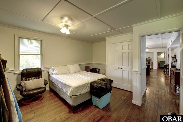 155 Loop Rd Lot 5, Ocracoke, NC 27960 - bedroom with wood finished floors, wainscoting, coffered ceiling, a closet, and ornamental molding
