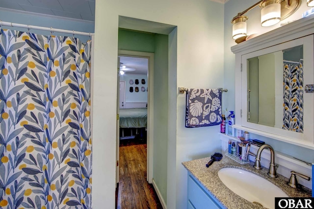 155 Loop Rd Lot 5, Ocracoke, NC 27960 - ensuite bathroom with vanity, wood finished floors, and a shower with shower curtain