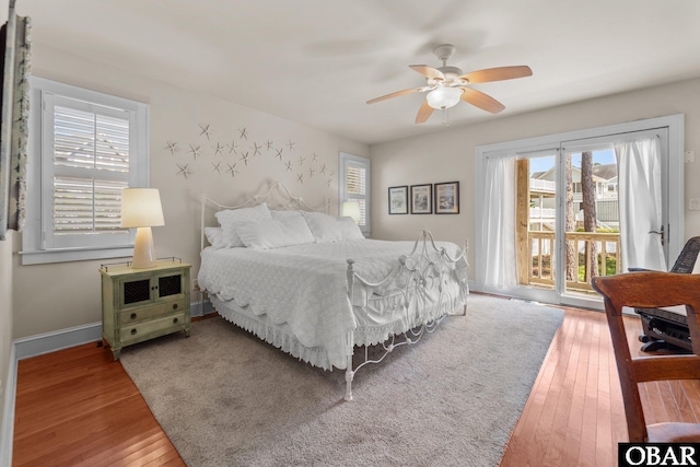 1148 Dunton Dr Lot 337, Corolla, NC 27927 - bedroom with access to outside, ceiling fan, baseboards, and hardwood / wood-style floors