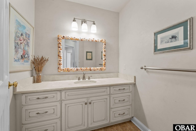 1148 Dunton Dr Lot 337, Corolla, NC 27927 - bathroom with vanity, baseboards, and wood finished floors