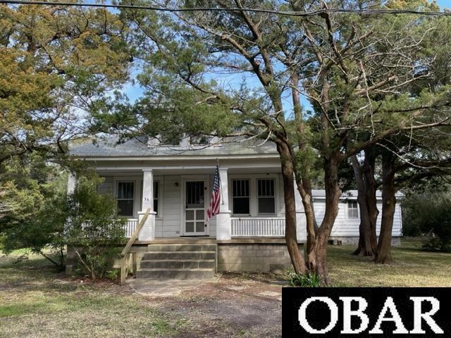 56 Nubbins Rdg, Ocracoke, NC 27960 - view of front of property featuring covered porch