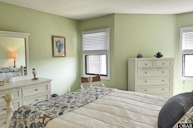 bedroom featuring a textured ceiling