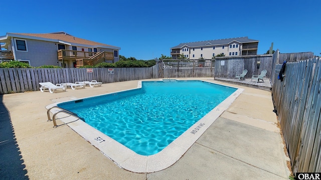 2009 Wrightsville Blvd Unit 1-B, Kill Devil Hills, NC 27948 - community pool with a fenced backyard and a patio