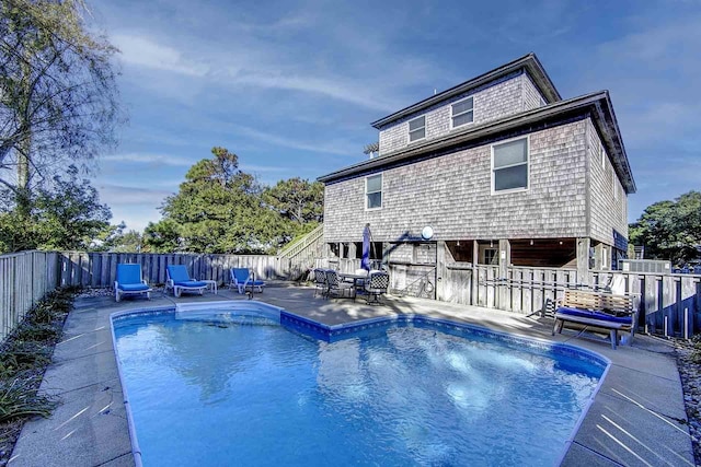 view of pool with a fenced backyard, a fenced in pool, and a patio