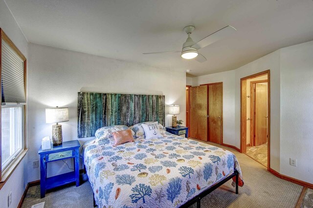 bedroom with carpet, a closet, visible vents, ceiling fan, and baseboards