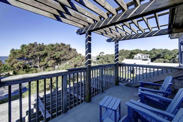 balcony featuring a pergola