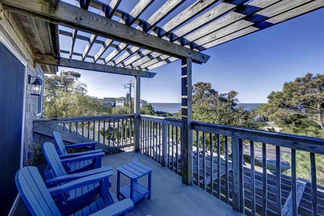 balcony featuring a pergola