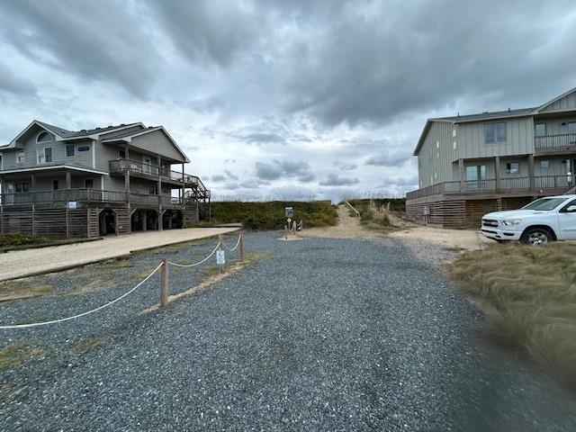 view of road featuring gravel driveway