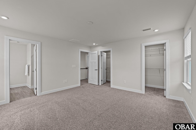 307 Sunny Lk Lot 106, Moyock, NC 27958 - unfurnished bedroom featuring a spacious closet, carpet, recessed lighting, ensuite bath, and a closet