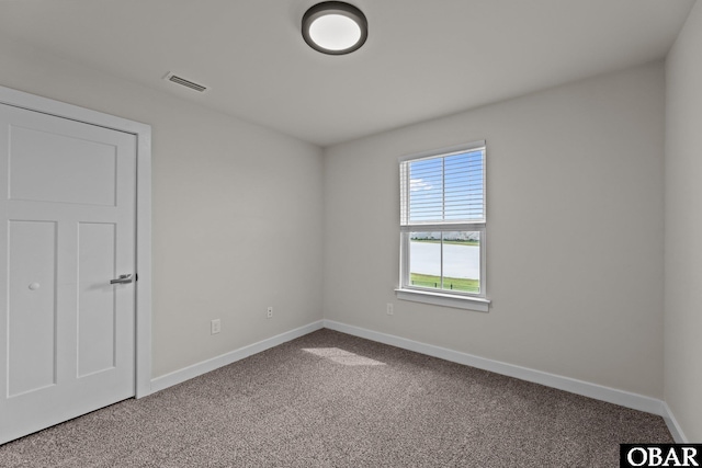 307 Sunny Lk Lot 106, Moyock, NC 27958 - spare room featuring carpet and baseboards
