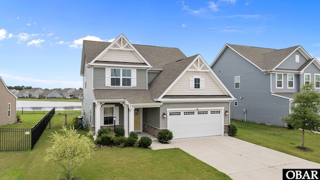 307 Sunny Lk Lot 106, Moyock, NC 27958 - view of front of house featuring concrete driveway, a shingled roof, and a residential view