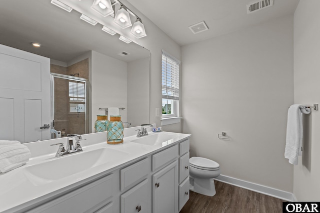 307 Sunny Lk Lot 106, Moyock, NC 27958 - full bathroom with double vanity, wood finished floors, and a shower stall