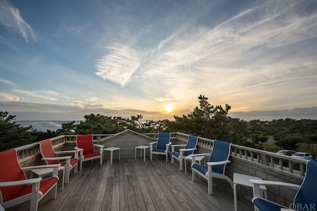 wooden terrace featuring a water view