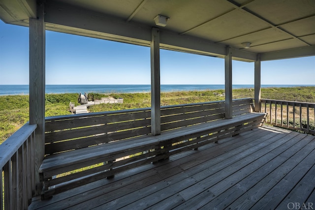 wooden deck with a water view