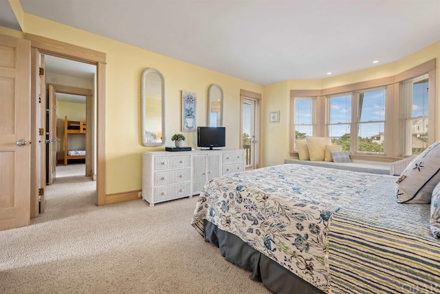 bedroom with baseboards, recessed lighting, and light colored carpet