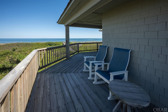 wooden deck with a water view