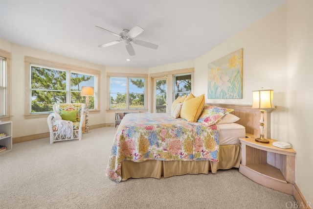 bedroom with carpet floors, ceiling fan, and baseboards