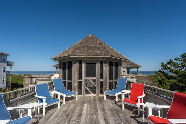 wooden deck featuring a water view