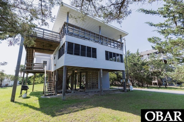 27250 Dory Rd Lot # 6, Salvo, NC 27972 - rear view of house with stairway, a lawn, and a balcony