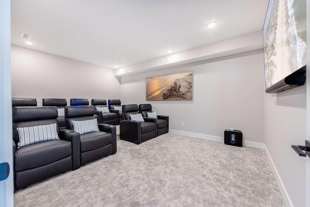 home theater room featuring light carpet, baseboards, and recessed lighting