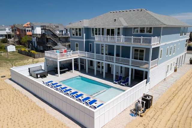 view of pool featuring a residential view, a patio area, a fenced backyard, and a fenced in pool