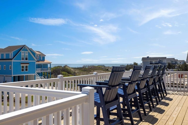 wooden deck featuring a water view