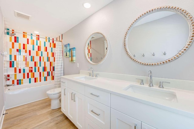 full bath with toilet, washtub / shower combination, visible vents, and a sink