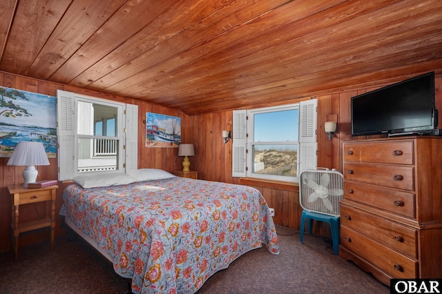 carpeted bedroom featuring wooden ceiling and wooden walls