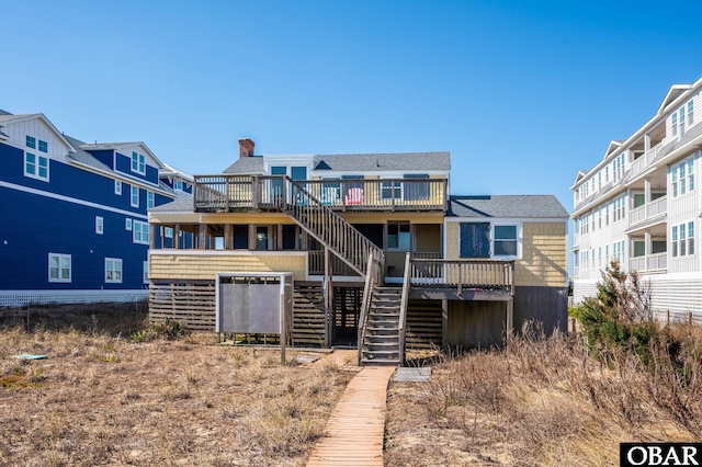 view of front of property featuring stairway