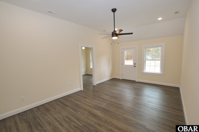 empty room with visible vents, baseboards, dark wood finished floors, ceiling fan, and recessed lighting