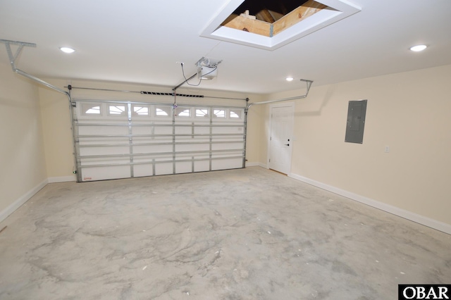 garage featuring a garage door opener, electric panel, and baseboards