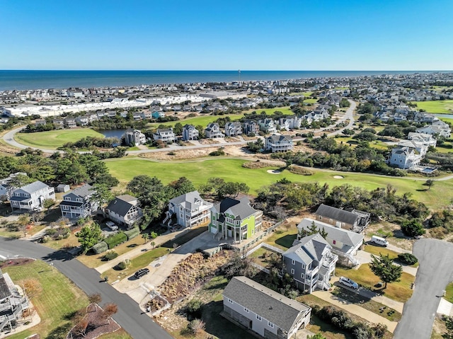 bird's eye view featuring a residential view, view of golf course, and a water view