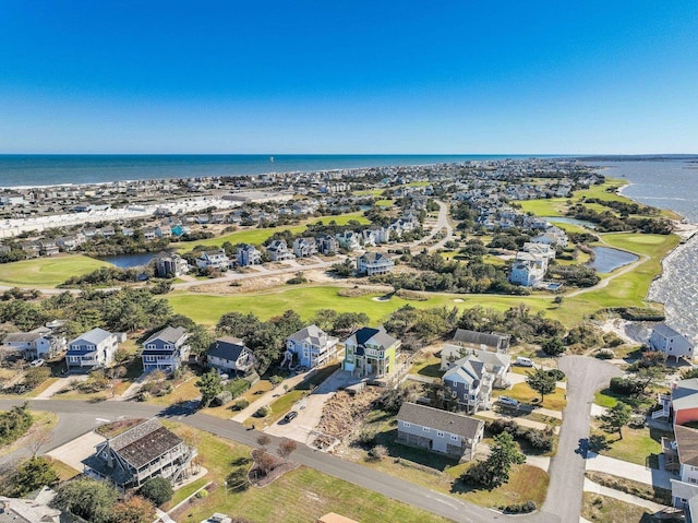 birds eye view of property with a residential view and a water view