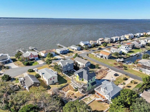 birds eye view of property with a residential view and a water view