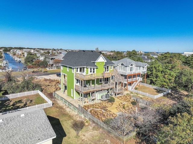 bird's eye view featuring a residential view and a water view